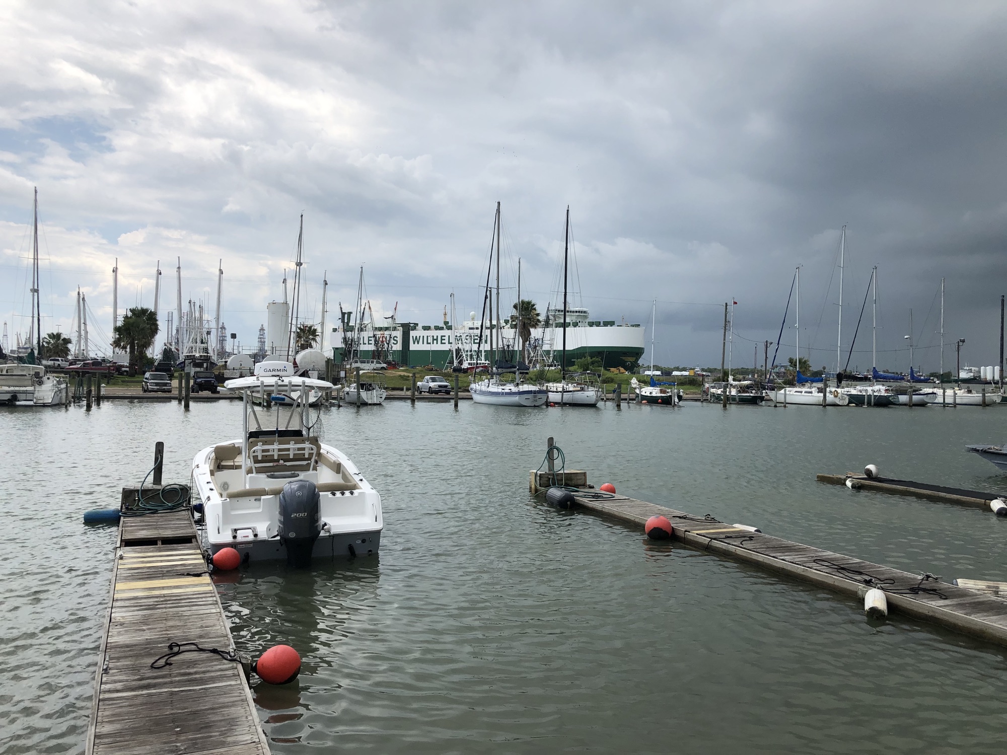 Rumo 20 moored in the marina beneath a dramatic coastal sky